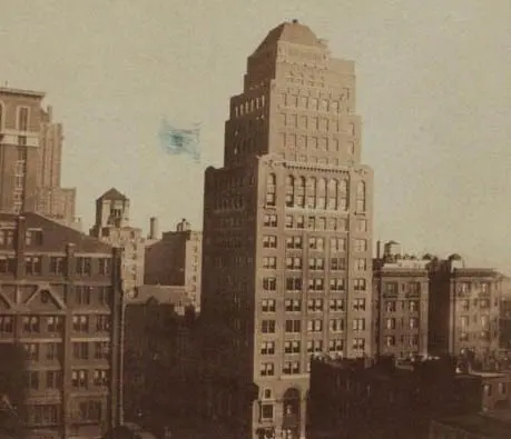 Vintage cityscape with tall, historic building.