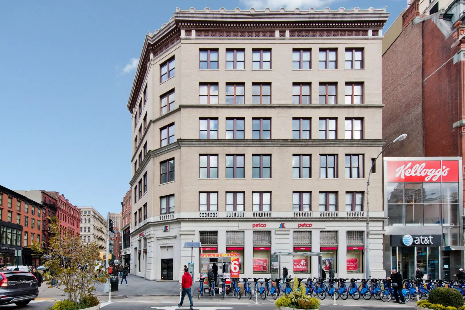 Urban street with historic multi-story building.
