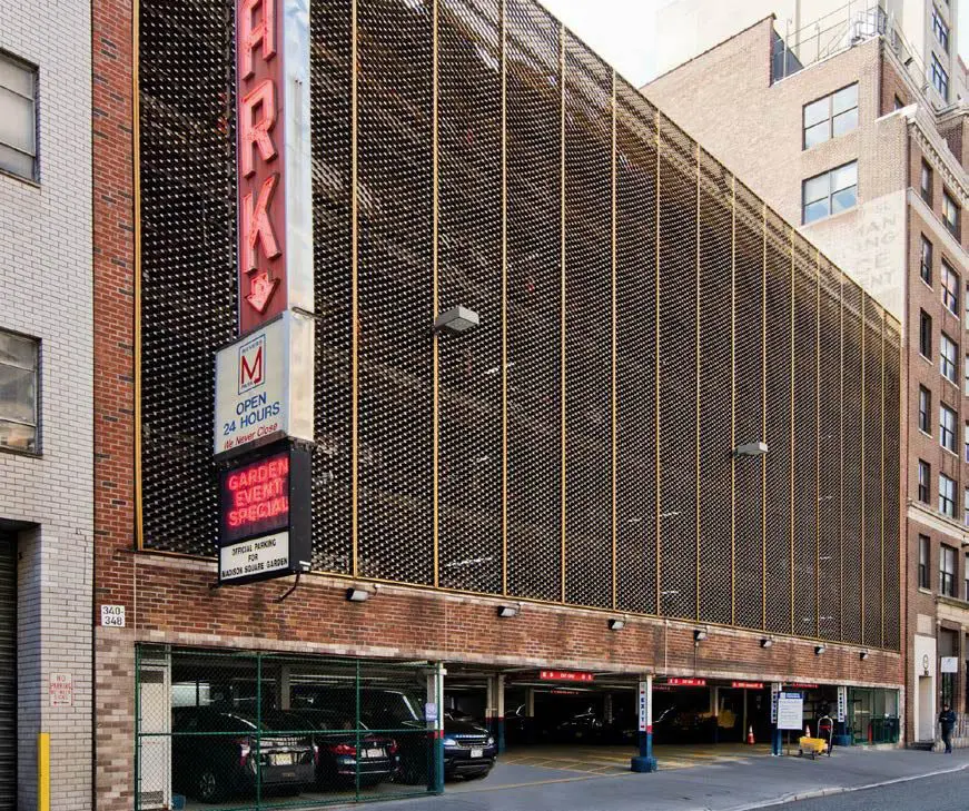 Outdoor urban multi-story parking garage entrance.